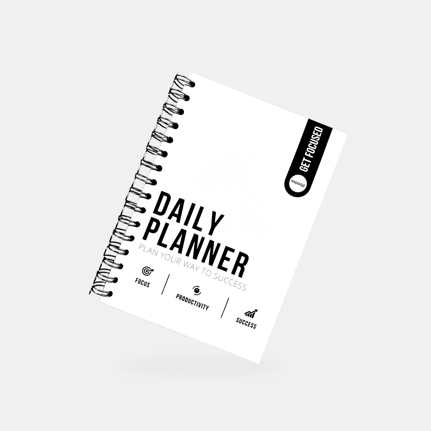 Daily Planner notebook with motivational text for focus and productivity in achieving success.