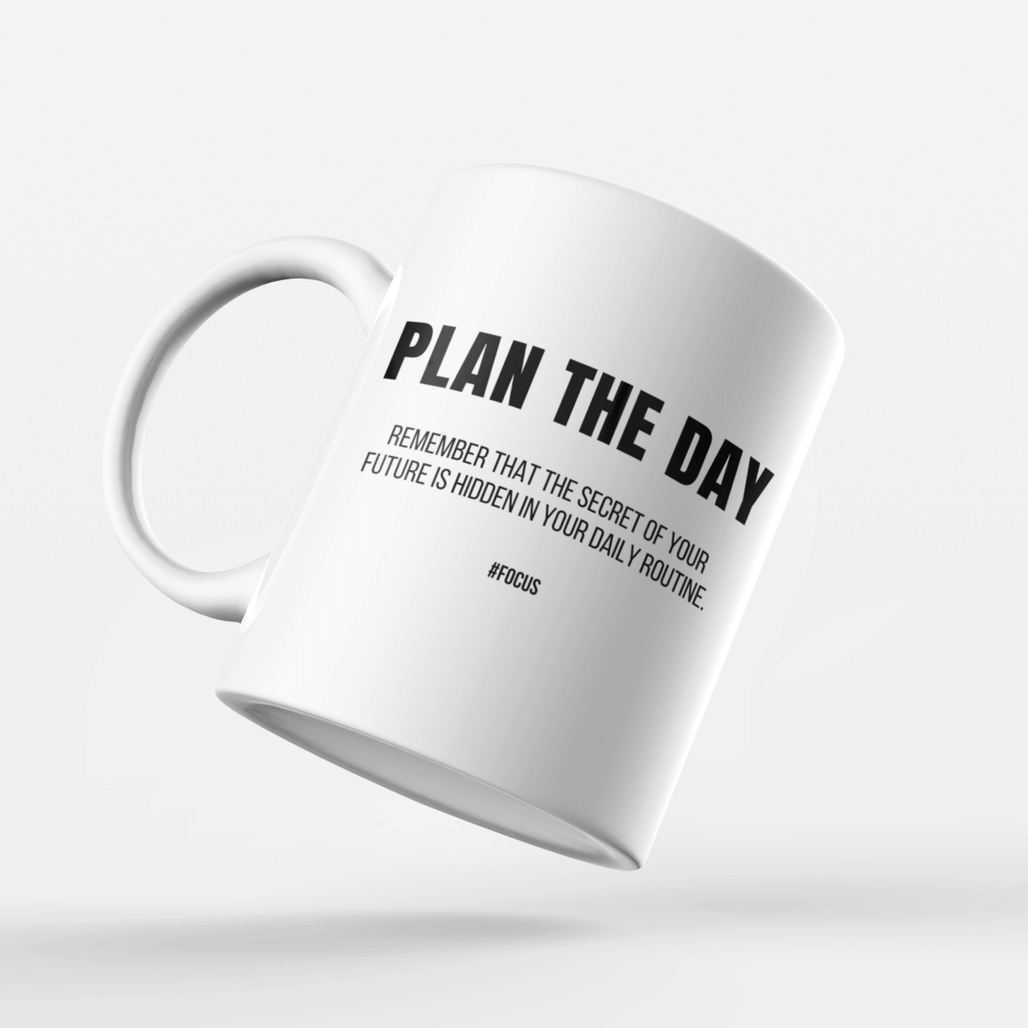 Motivational mug with 'Plan the Day' quote, perfect for daily inspiration and goal setting.